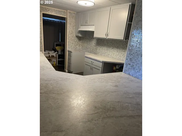 a view of kitchen and utility room