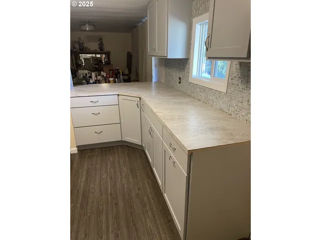 a kitchen with a sink and cabinets