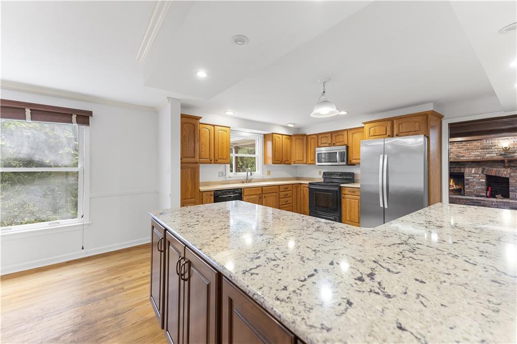 2 Carleton Drive Pittsburgh, PA 15243 - Photo 11 of 35 a kitchen with stainless steel appliances granite countertop a sink stove and refrigerator