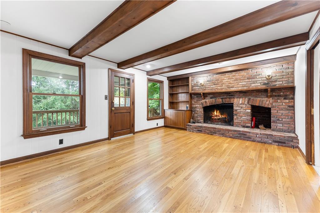 2 Carleton Drive Pittsburgh, PA 15243 - Photo 15 of 35 a view of empty room with wooden floor and fireplace
