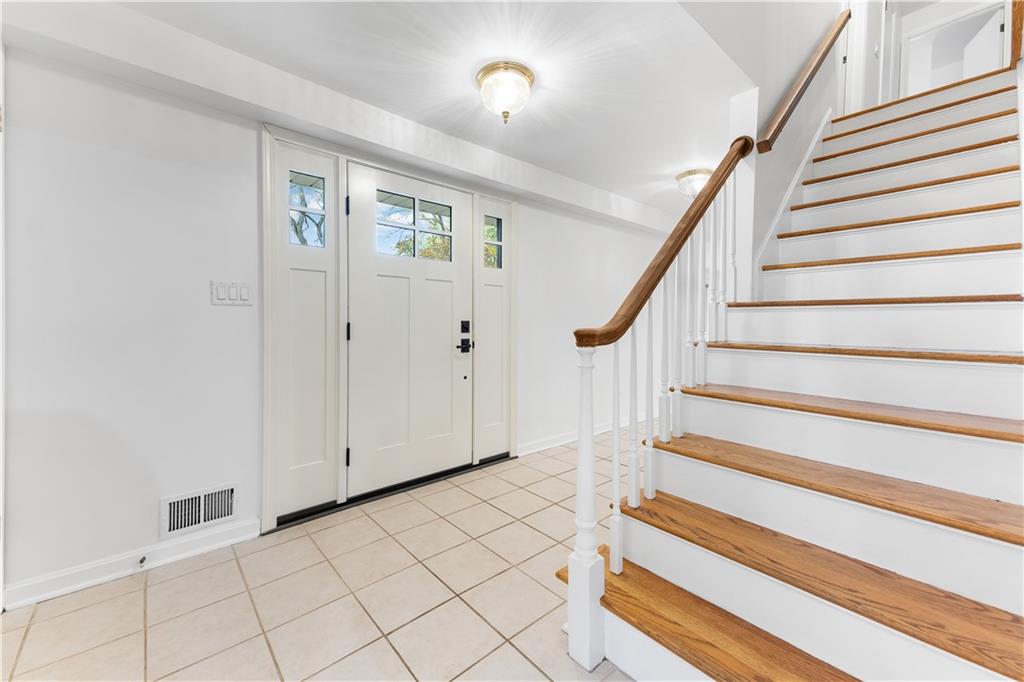 2 Carleton Drive Pittsburgh, PA 15243 - Photo 18 of 35 a view of entryway with wooden floor and stairs