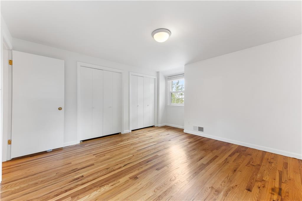 2 Carleton Drive Pittsburgh, PA 15243 - Photo 26 of 35 a view of an empty room with wooden floor and a window