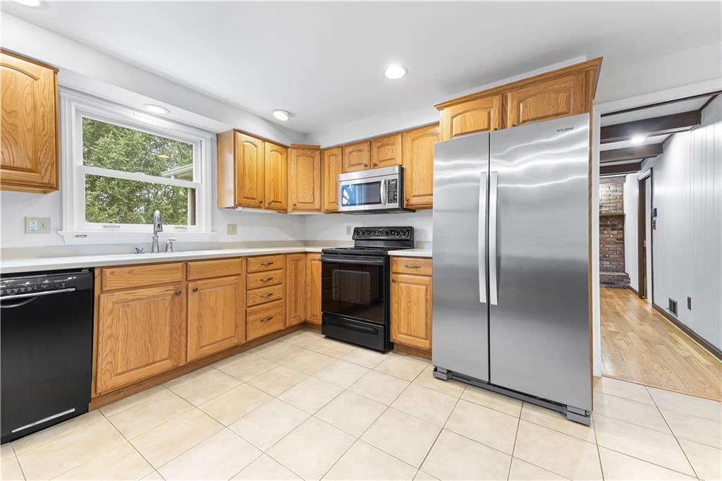2 Carleton Drive Pittsburgh, PA 15243 - Photo 10 of 35 a kitchen with stainless steel appliances granite countertop a refrigerator sink and cabinets