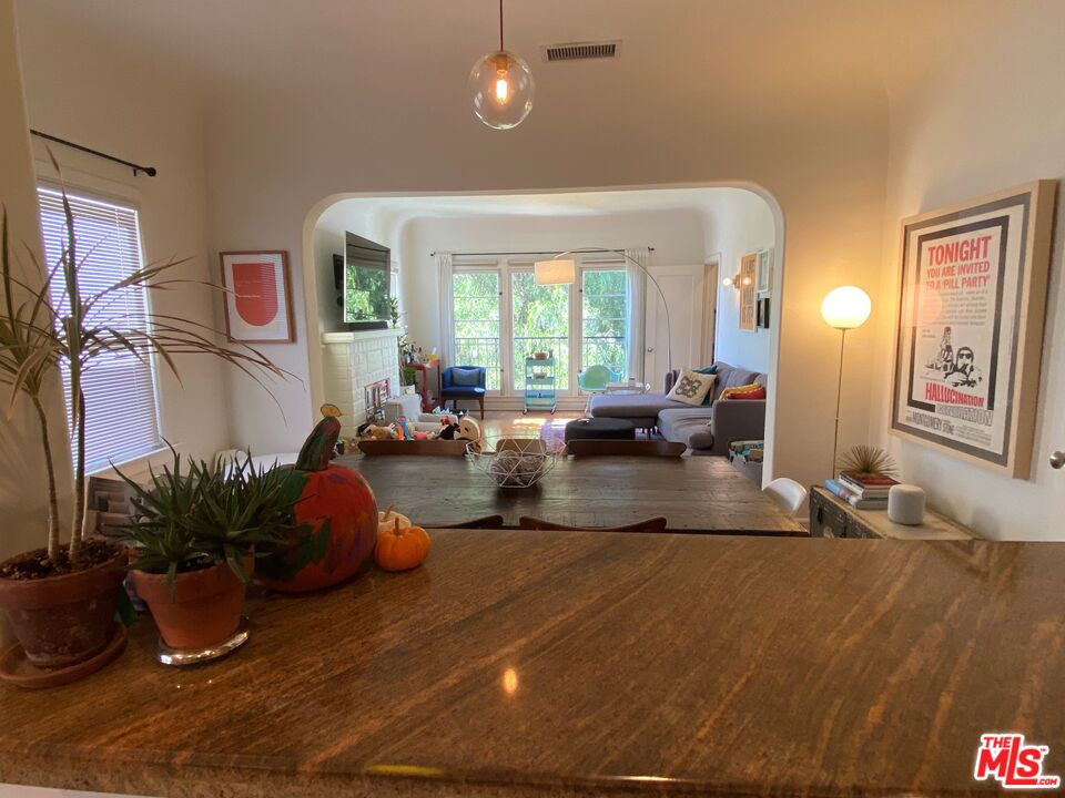 506 North Spaulding Avenue Los Angeles, CA 90036 - Photo 20 of 23 a living room with furniture potted plant and a large window