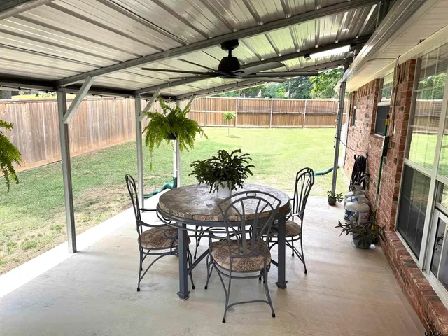 a view of a two chairs in the patio