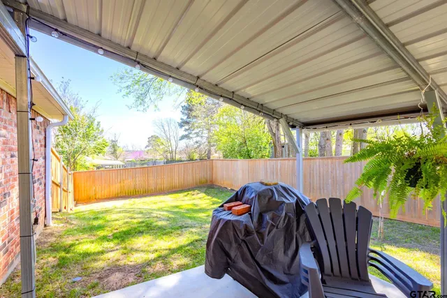 a view of a swimming pool with a patio