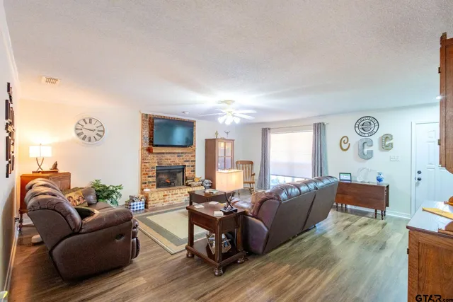 a living room with furniture window and wooden floor