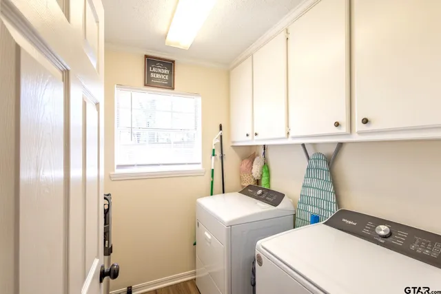 a view of bathroom with a sink and a window