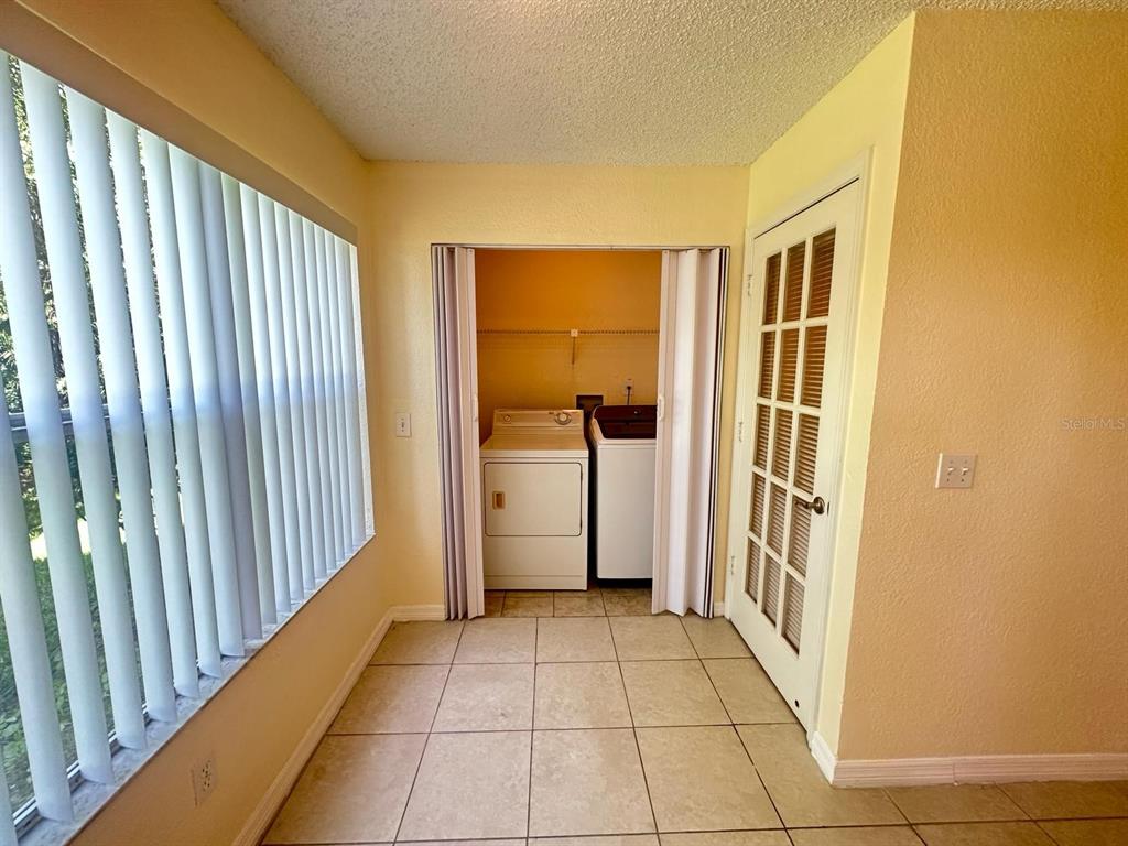 5120 Conroy Road, Unit 13 Orlando, FL 32811 - Photo 11 of 21 a view of a hallway with a outdoor space