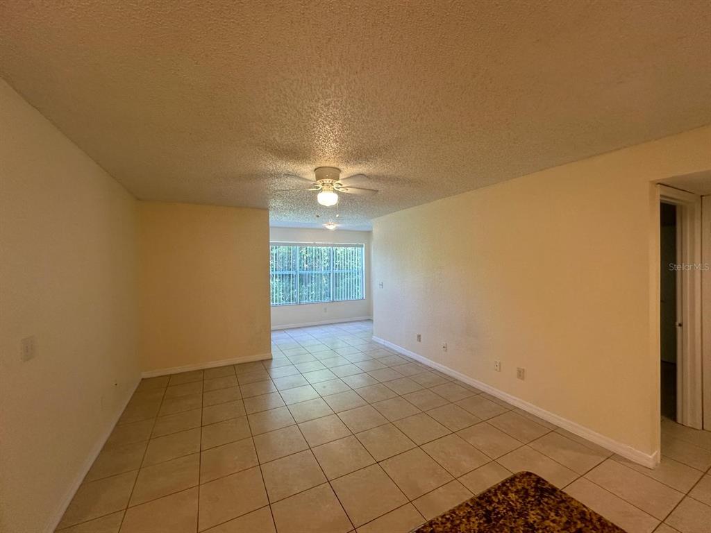 5120 Conroy Road, Unit 13 Orlando, FL 32811 - Photo 2 of 21 a view of an empty room