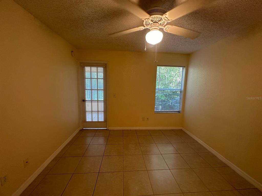 5120 Conroy Road, Unit 13 Orlando, FL 32811 - Photo 8 of 21 a view of an empty room with a window