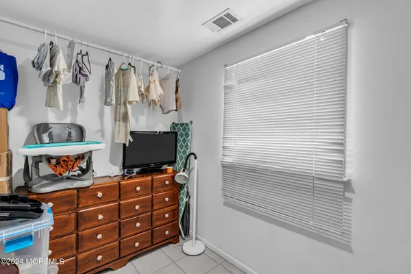 a room with furniture and a potted plant