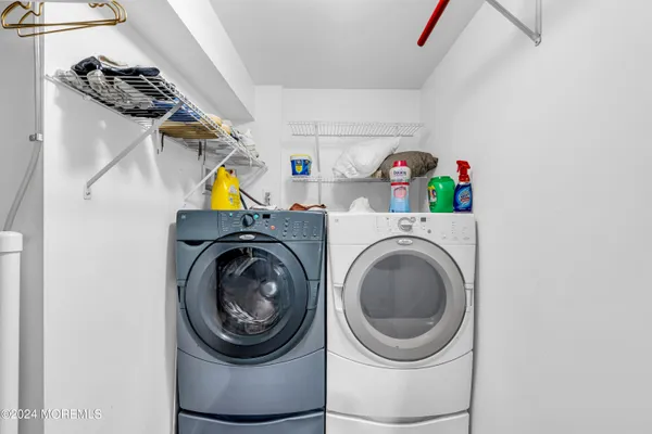 a view of a roof deck with wooden fence and floor