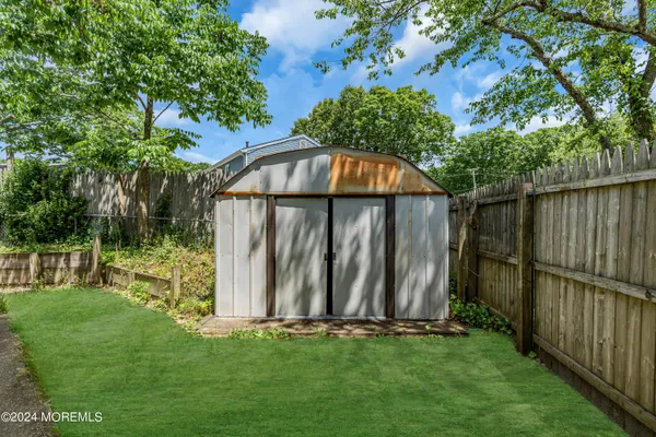 a view of a back yard of the house
