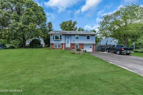 a view of a house with a back yard