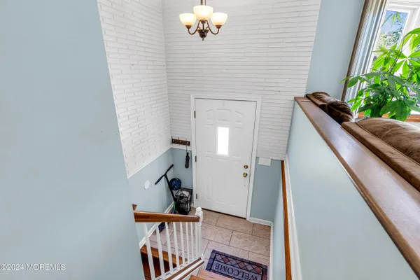 a view of staircase with a rug