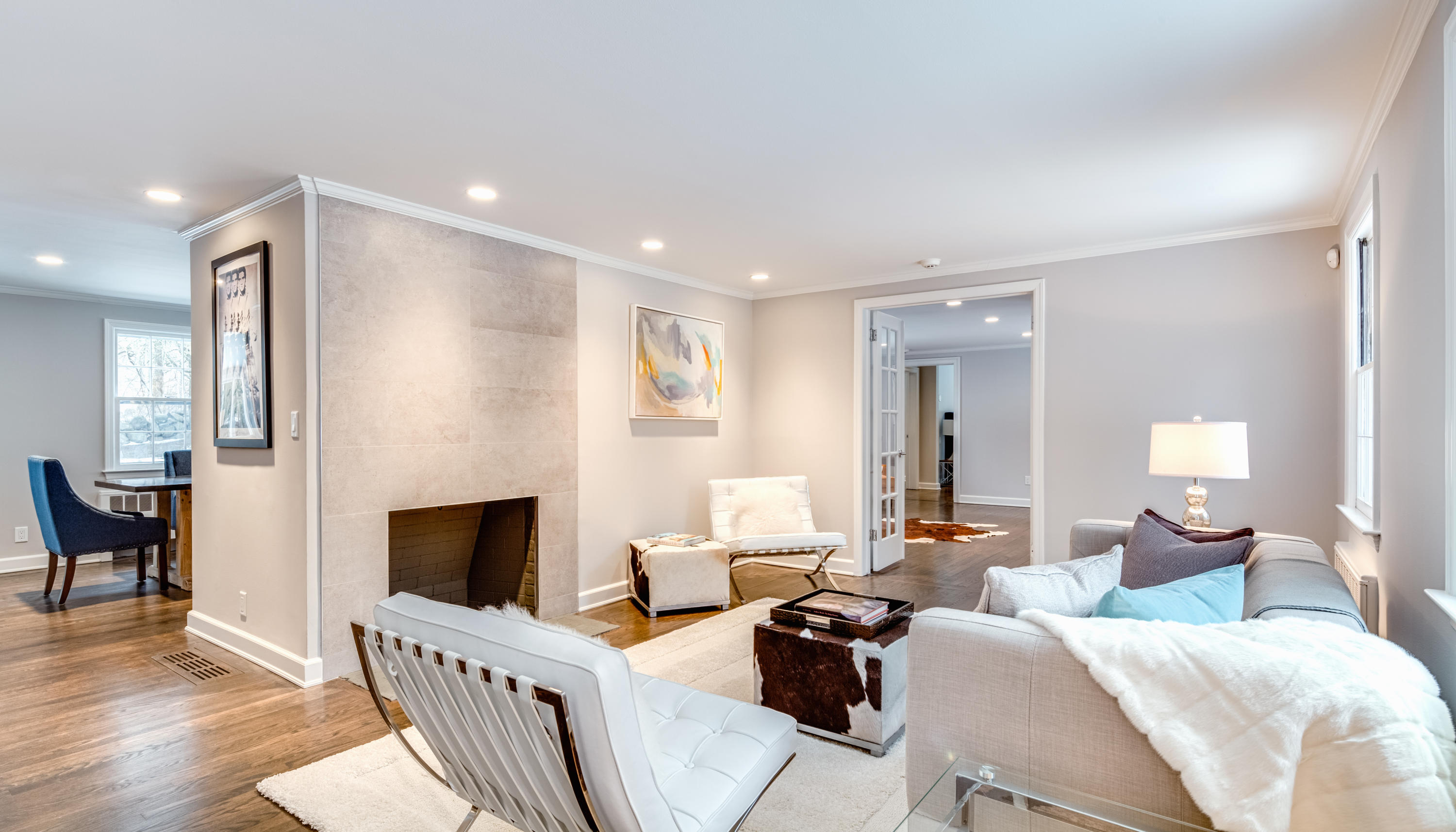 61 Juniper Road New Canaan, CT 06840 - Photo 2 of 17 a living room with furniture a fireplace and a flat screen tv