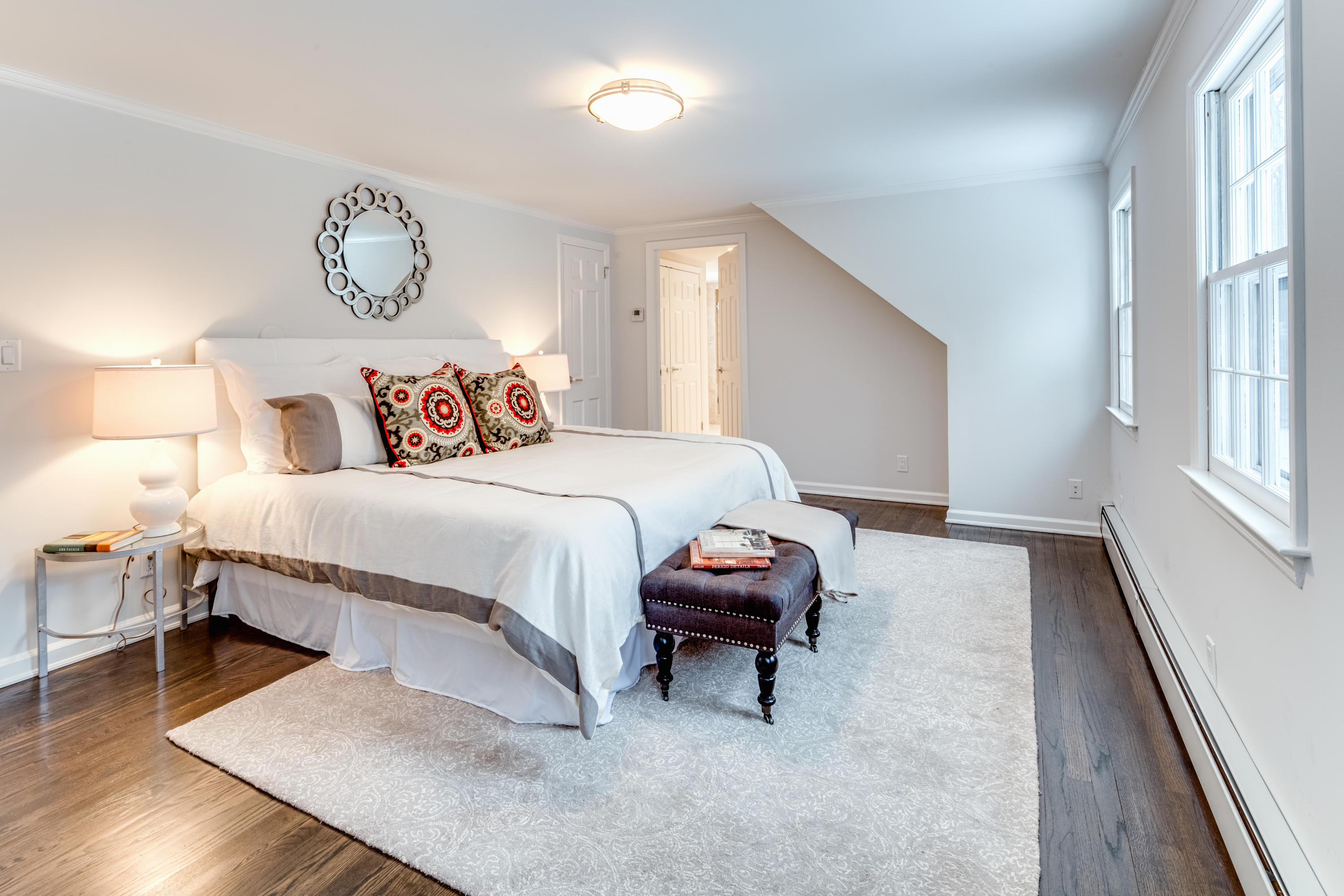 61 Juniper Road New Canaan, CT 06840 - Photo 13 of 17 a bedroom with a bed and a table with wooden floor