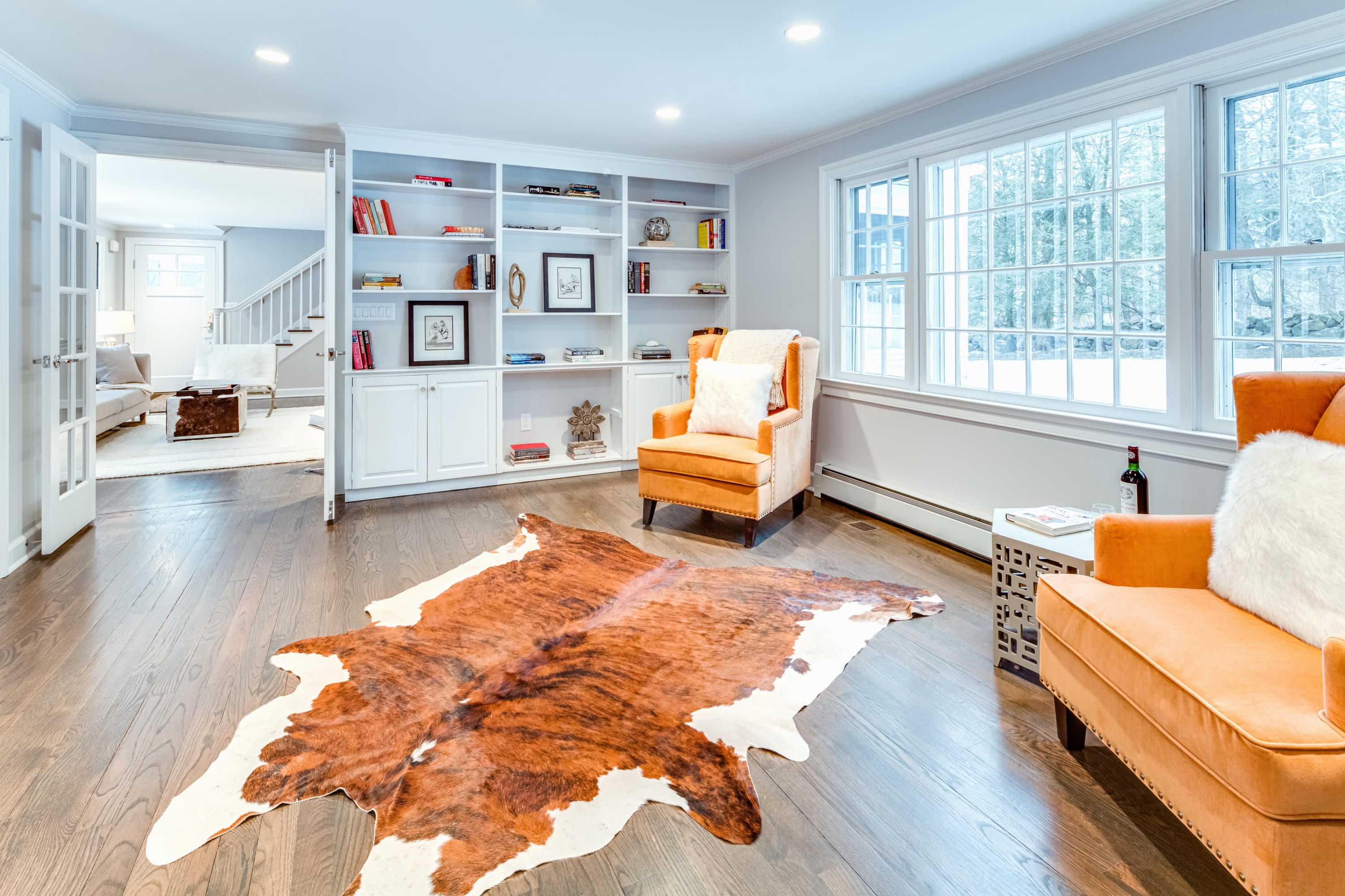 61 Juniper Road New Canaan, CT 06840 - Photo 8 of 17 a living room with furniture and a book shelf