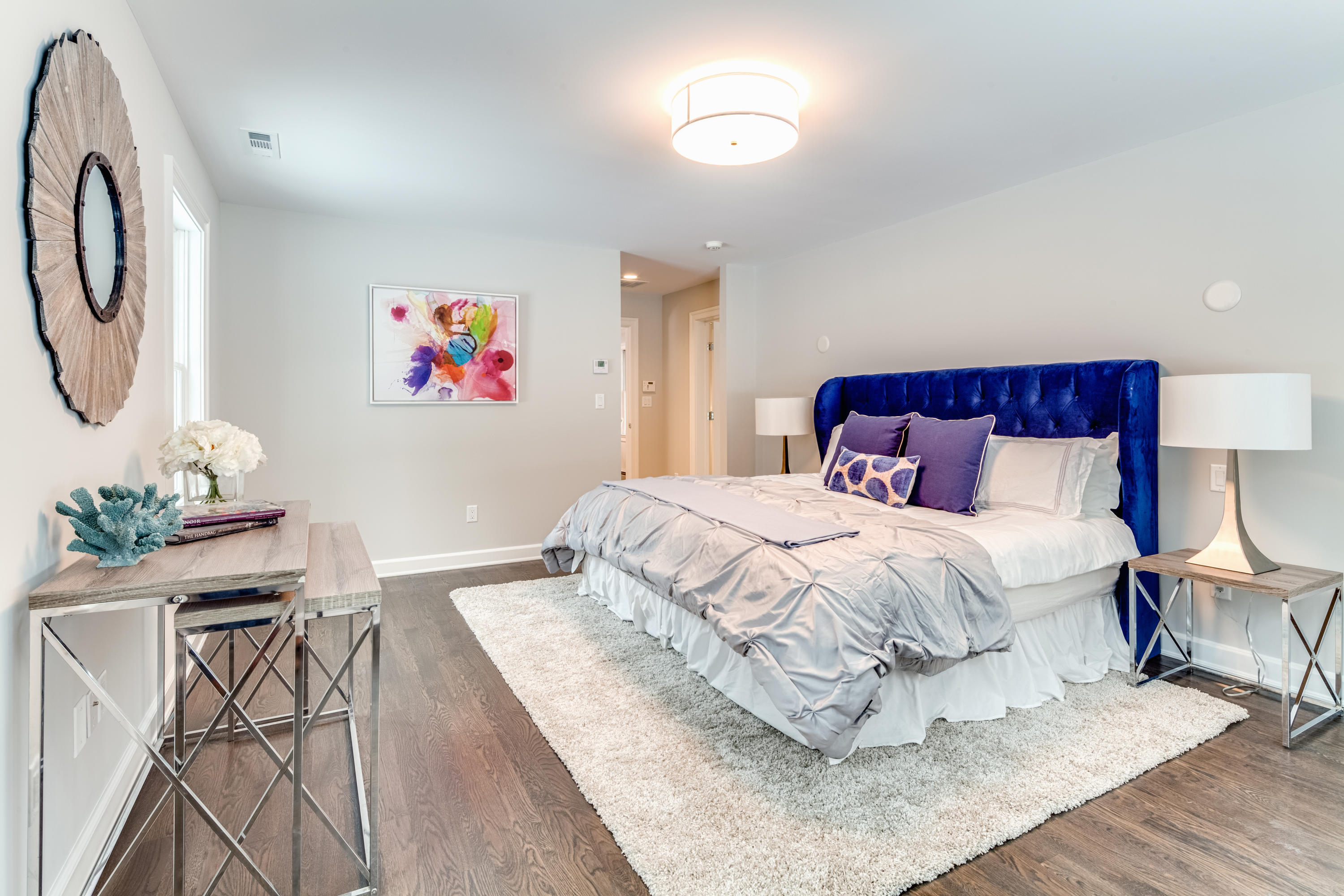 61 Juniper Road New Canaan, CT 06840 - Photo 10 of 17 a bedroom with a bed and painting on the wall