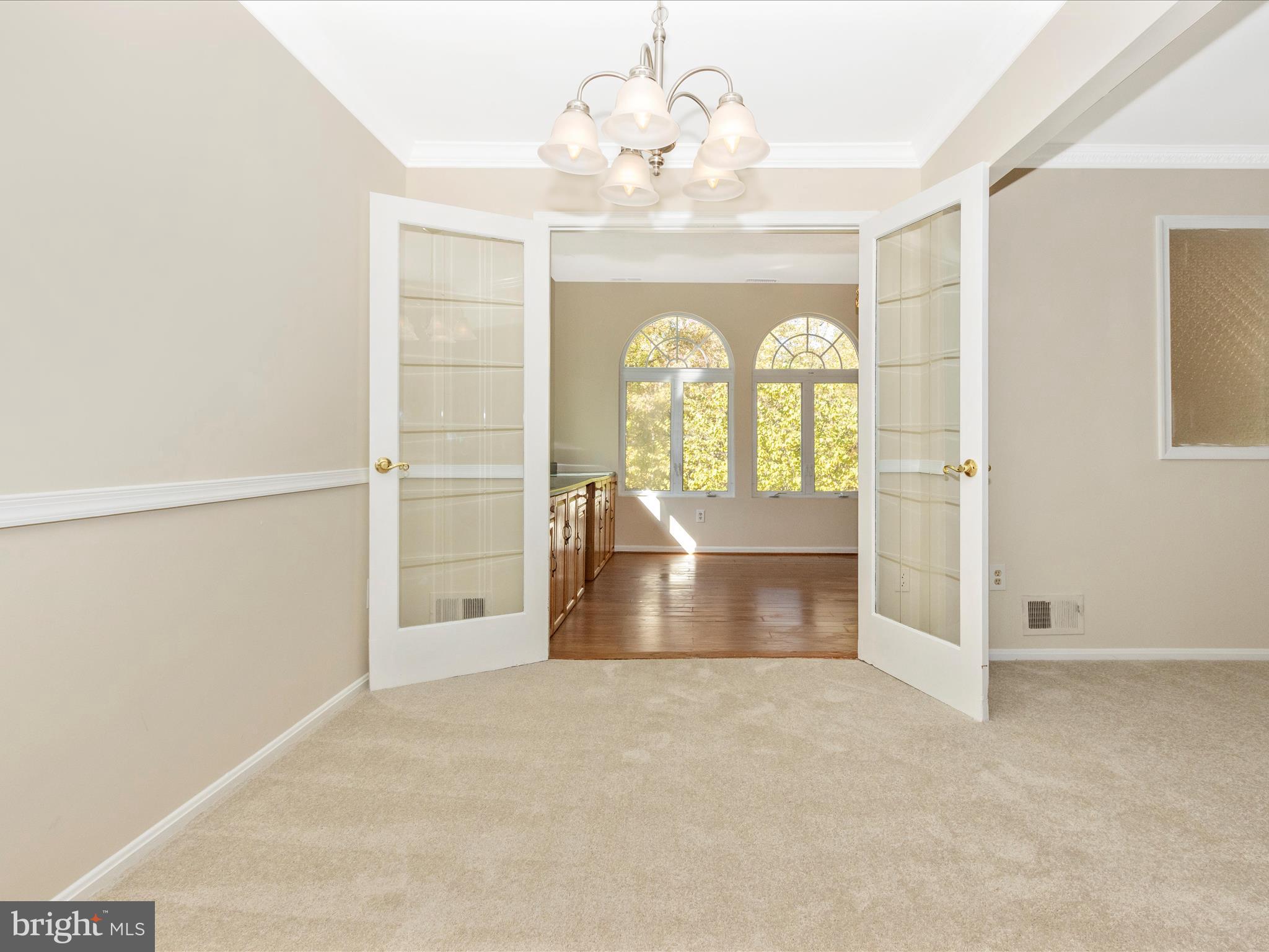 12844 Littleton Street Silver Spring, MD 20906 - Photo 10 of 43 Dining Room opens to sunroom addition
