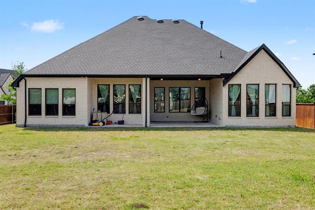 3508 Ruffian Court Celina, TX 75009 - Photo 25 of 33 Featuring a covered porch overlooking the large back yard