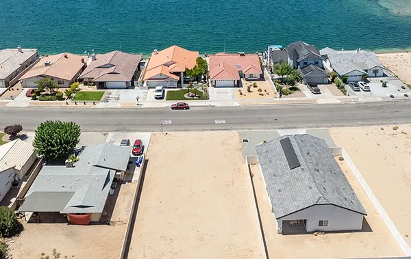an aerial view of residential houses with outdoor space