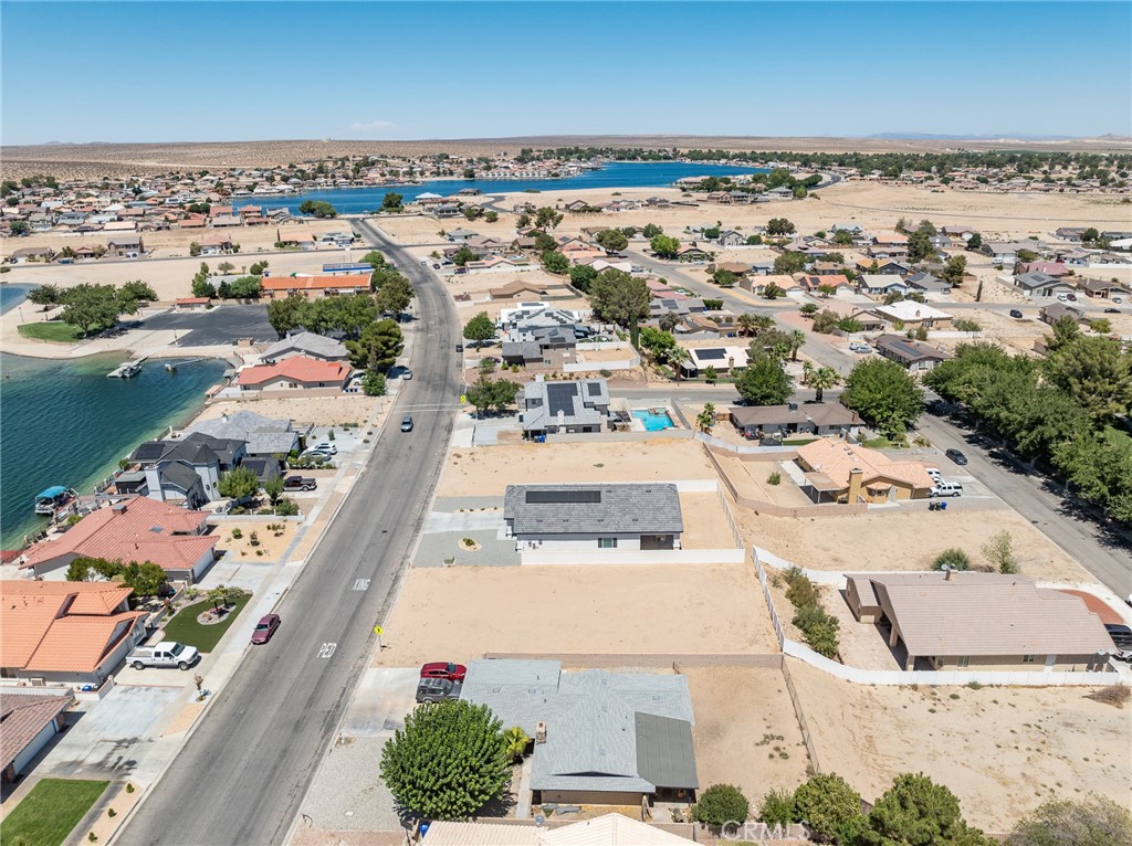 26701 Bluewater Road Helendale, CA 92342 - Photo 6 of 22 an aerial view of a residential building with an outdoor space and seating area