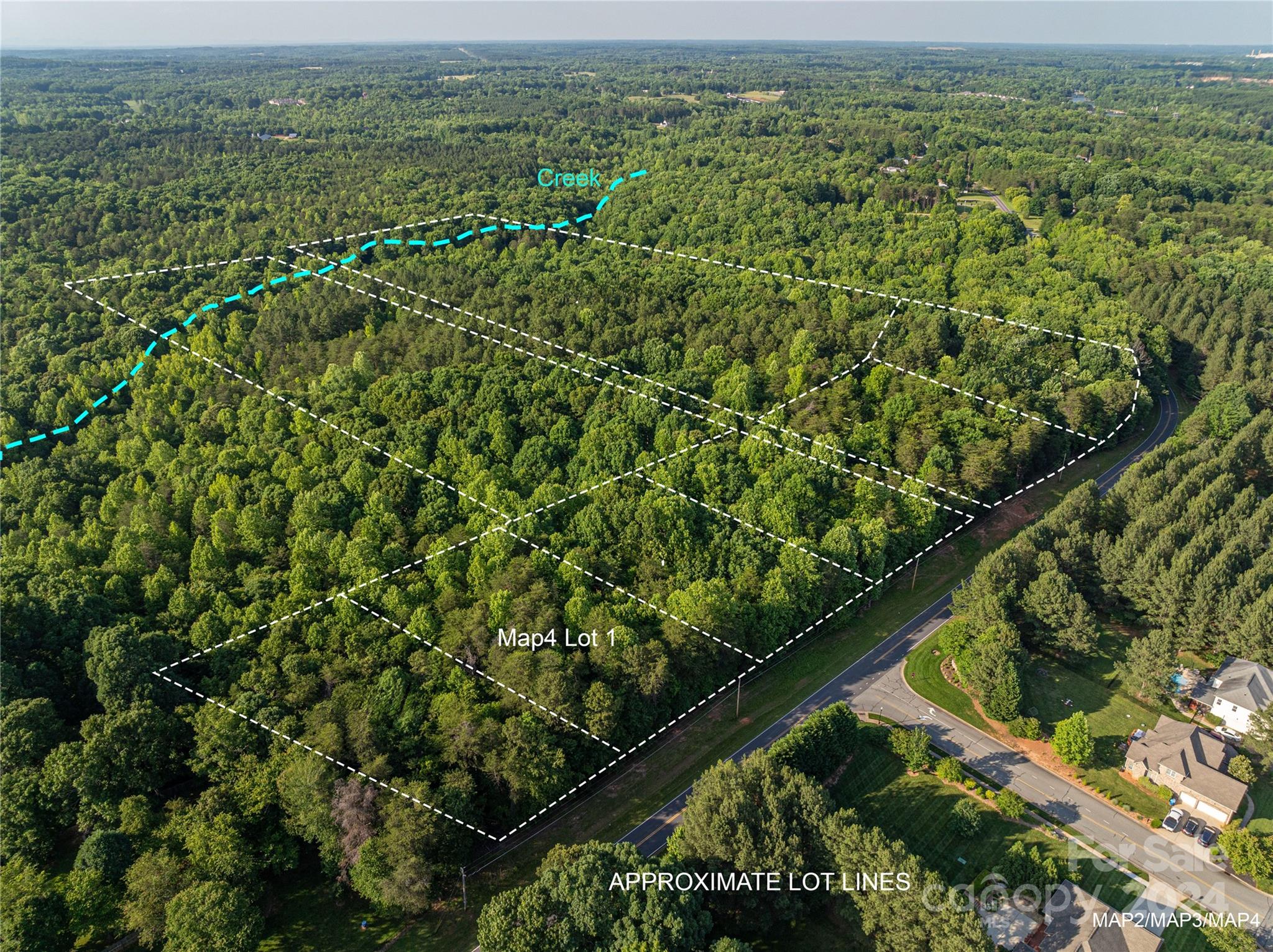 5117 Grassy Creek Road Denver, NC 28037 - Photo 3 of 12 an aerial view of residential houses with outdoor space and trees