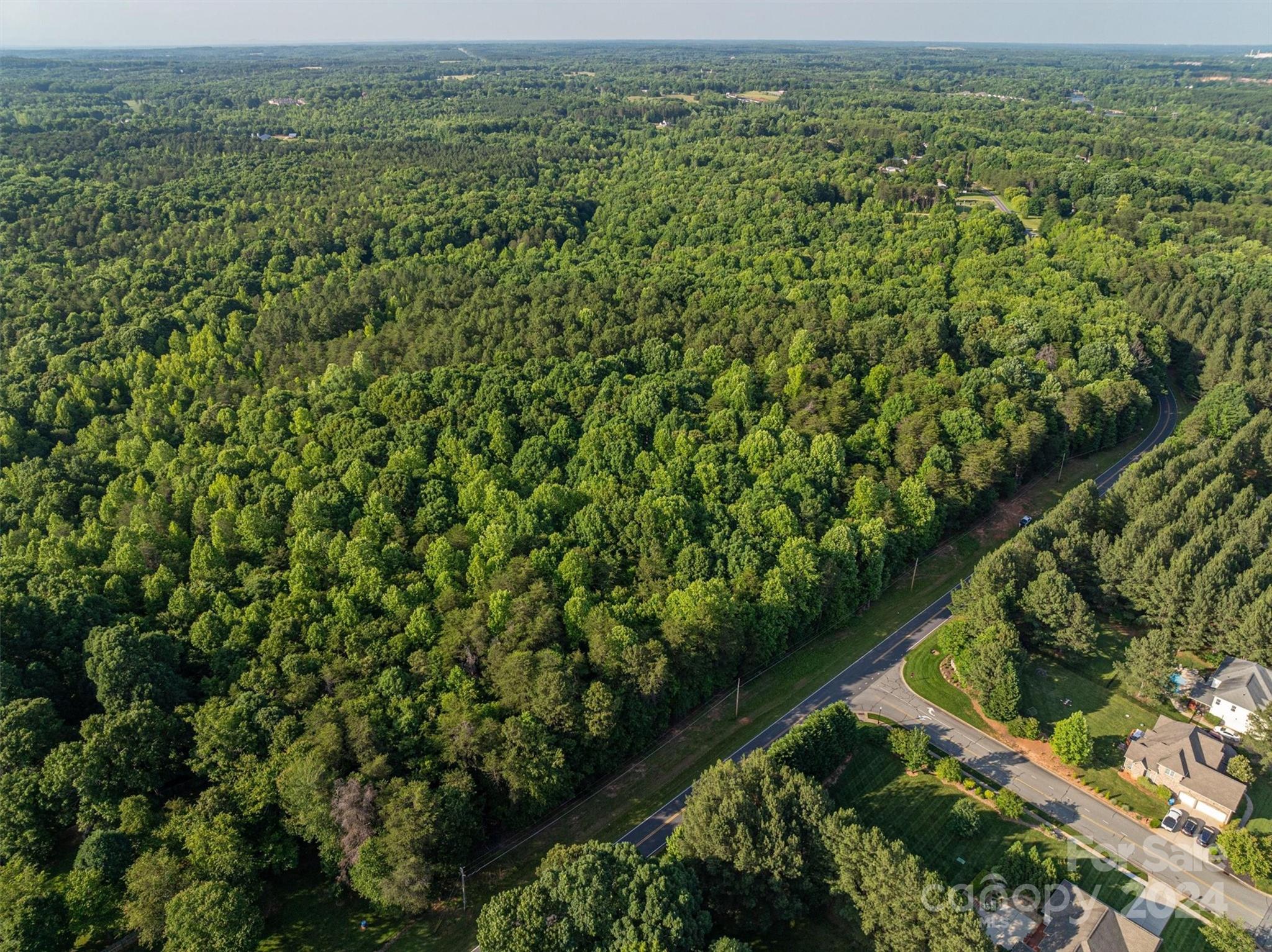 5117 Grassy Creek Road Denver, NC 28037 - Photo 7 of 12 a view of a lush green space with a lake view
