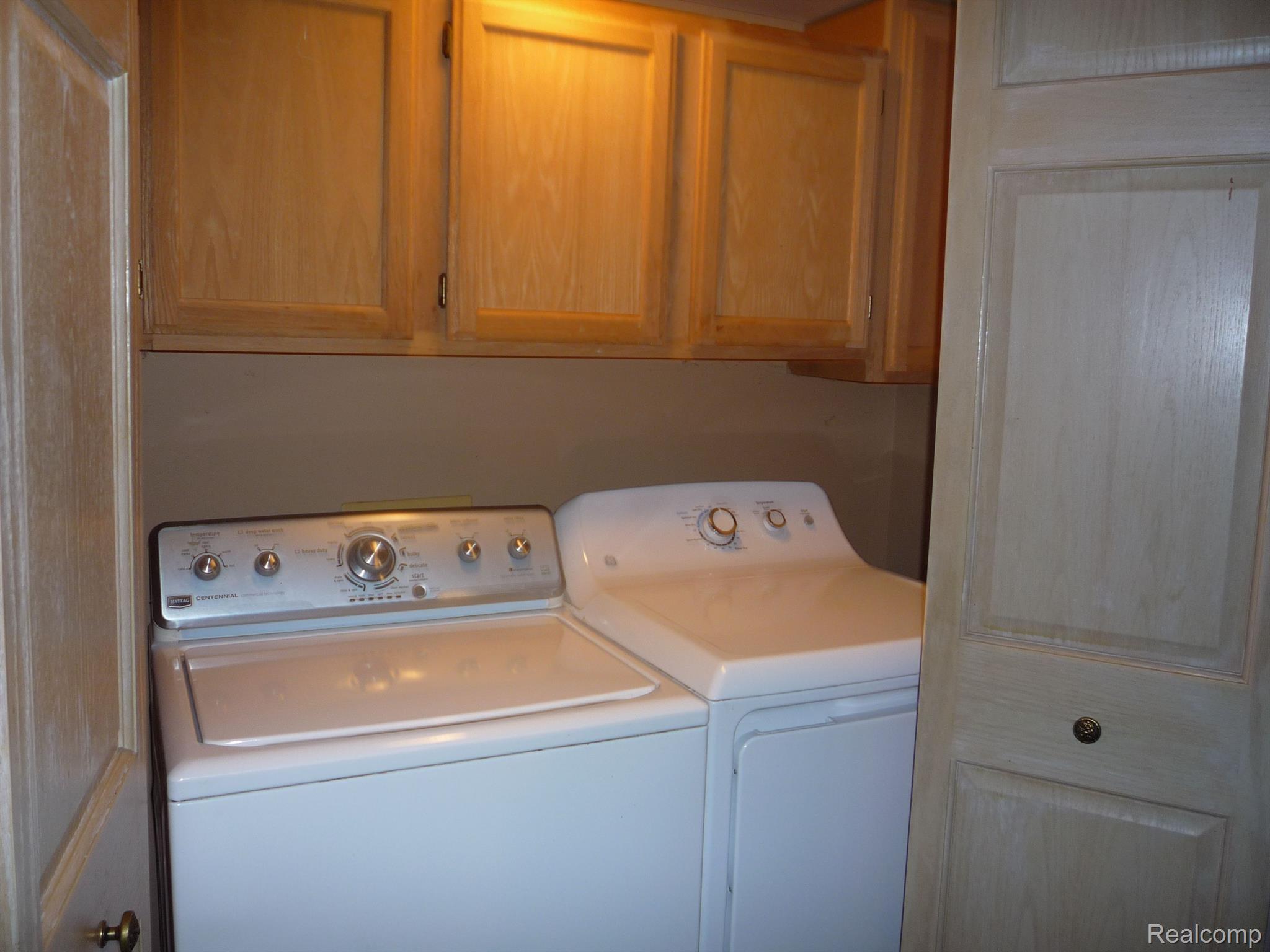 1423 Rillview Court Metamora, MI 48455 - Photo 11 of 62 laundry in closet in kitchen