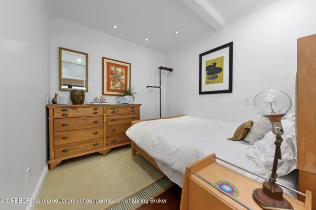 a bedroom with a bed and furniture