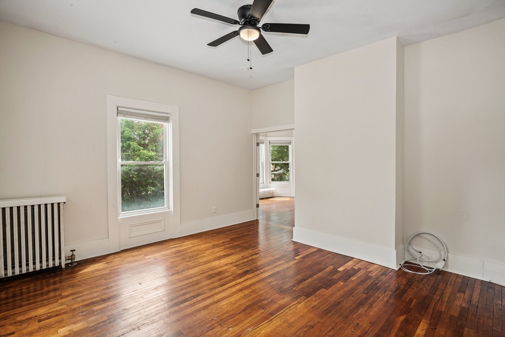 35 Oak Avenue, Unit 1 Worcester, MA 01605 - Photo 11 of 25 a view of empty room with wooden floor and fan