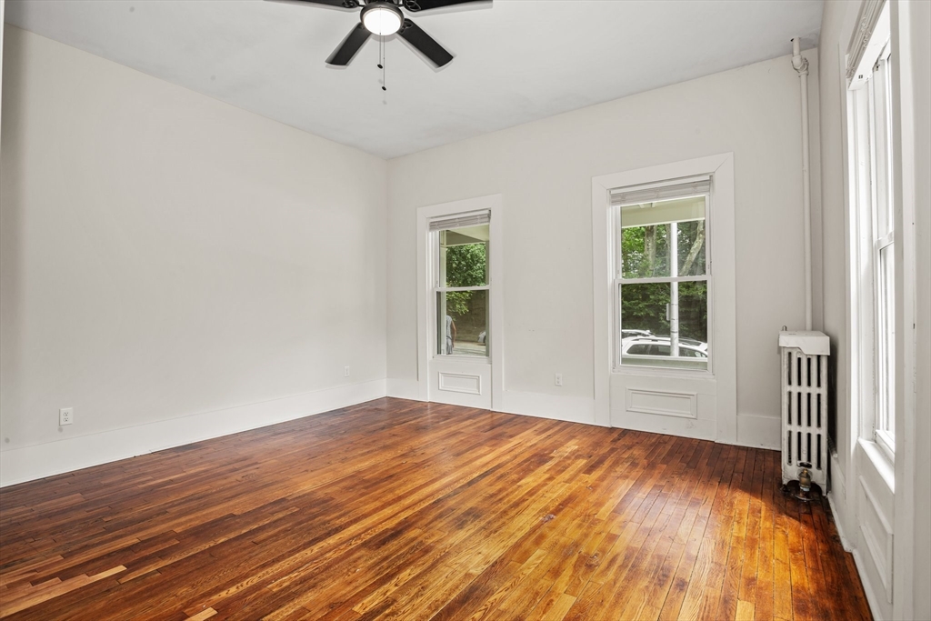 35 Oak Avenue, Unit 1 Worcester, MA 01605 - Photo 15 of 25 a view of empty room with wooden floor and fan