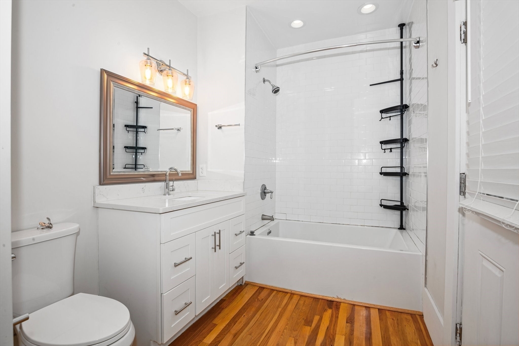 35 Oak Avenue, Unit 1 Worcester, MA 01605 - Photo 17 of 25 a bathroom with a sink a toilet and shower