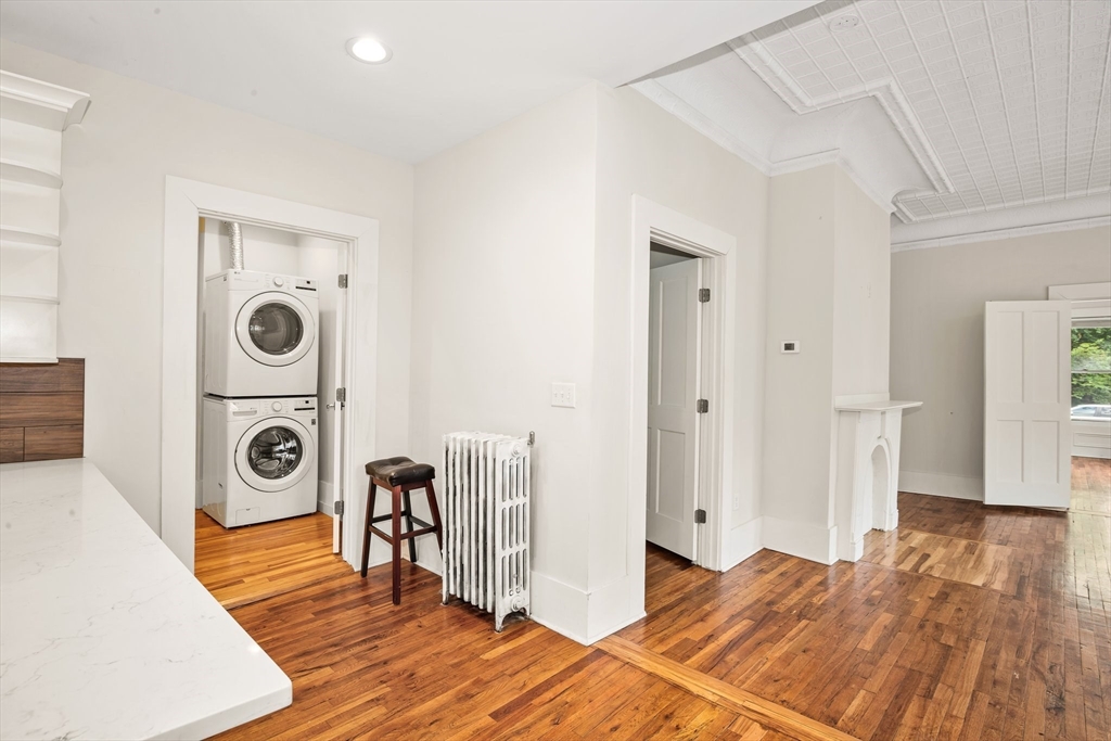 35 Oak Avenue, Unit 1 Worcester, MA 01605 - Photo 18 of 25 a view of a bedroom with a bed and wooden floor