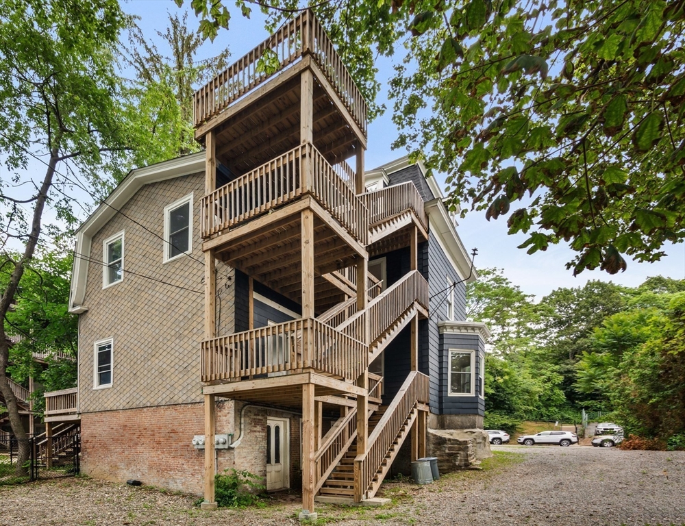 35 Oak Avenue, Unit 1 Worcester, MA 01605 - Photo 22 of 25 a front view of a house with a tree