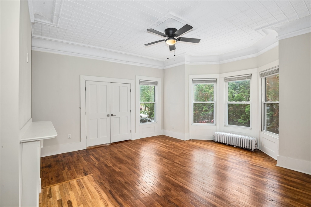 35 Oak Avenue, Unit 1 Worcester, MA 01605 - Photo 8 of 25 a view of an empty room with wooden floor and a window