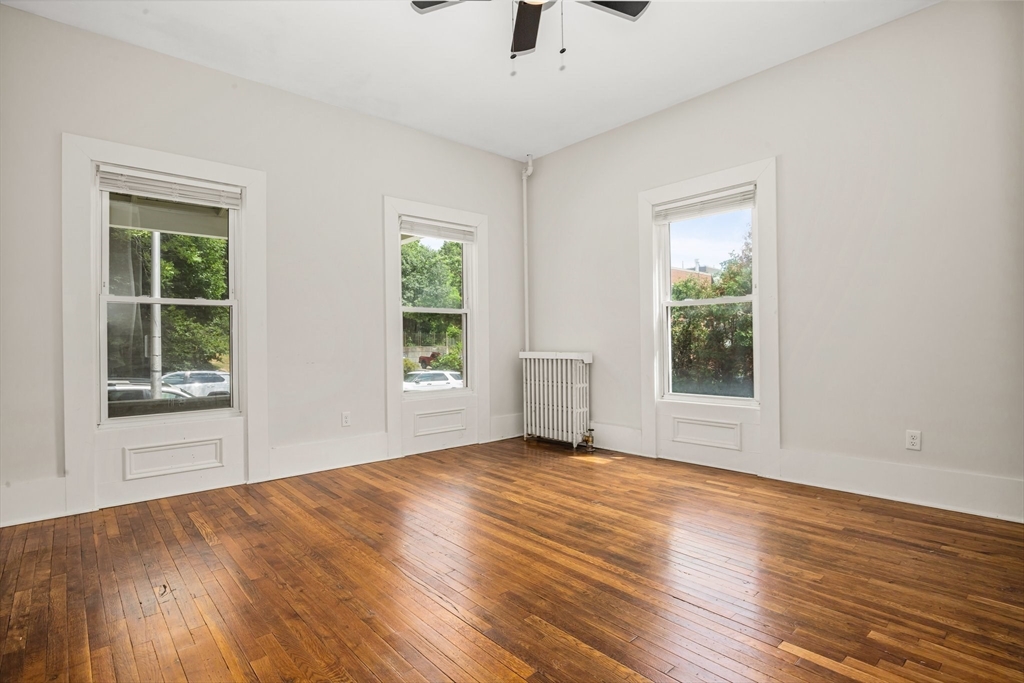 35 Oak Avenue, Unit 1 Worcester, MA 01605 - Photo 10 of 25 a view of an empty room with wooden floor and a window