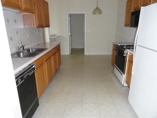 2 Grandview Court, Unit 2 Algonquin, IL 60102 - Photo 3 of 5 a kitchen with sink a refrigerator and a stove
