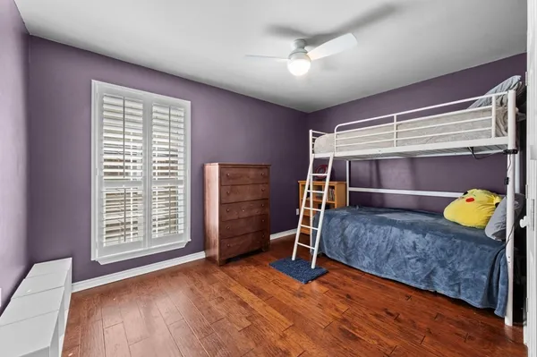 a bedroom with bed and window