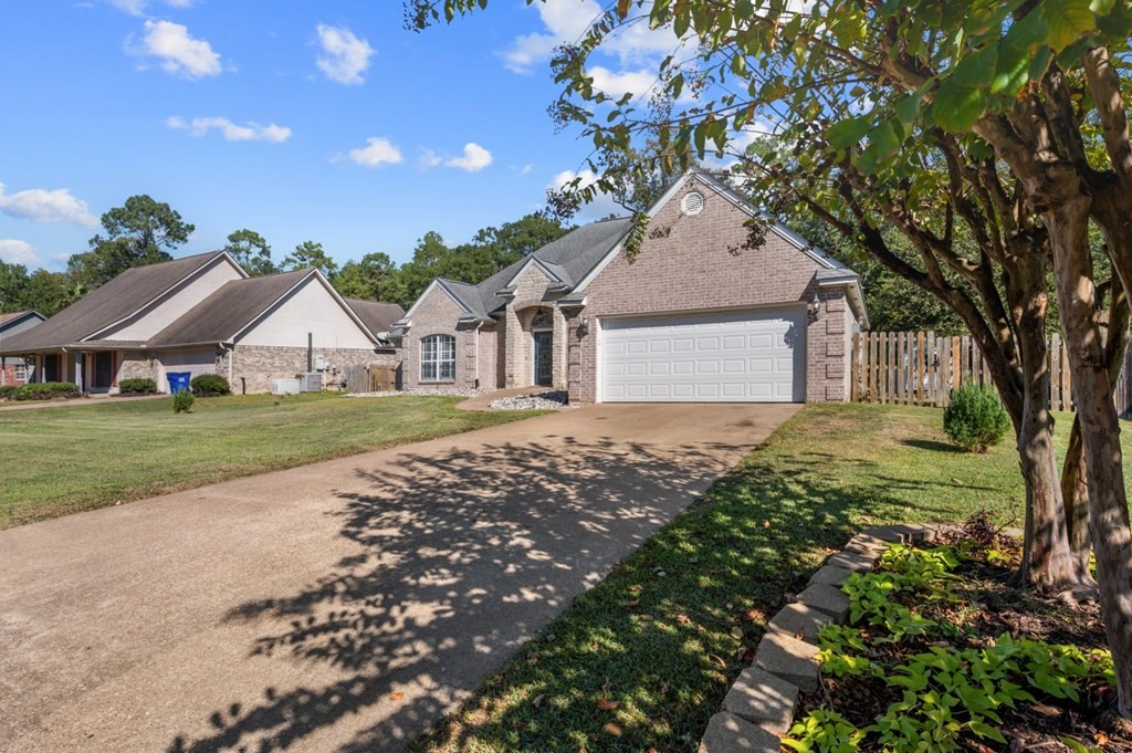365 Copperfield Loop Lufkin, TX 75904 - Photo 26 of 28 a front view of a house with garden