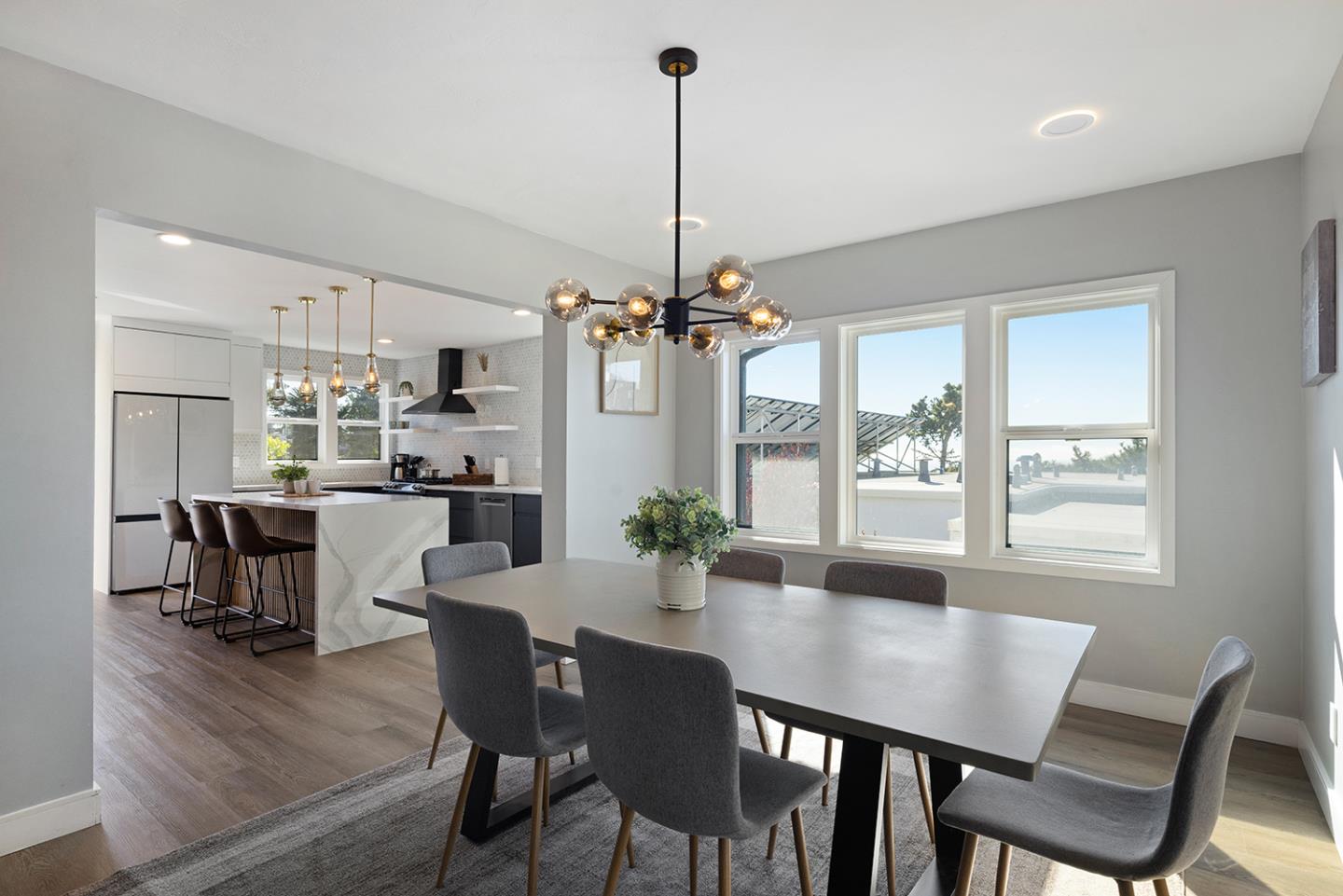 488 Monterey Road Pacifica, CA 94044 - Photo 21 of 78 a view of a dining room with furniture window and wooden floor
