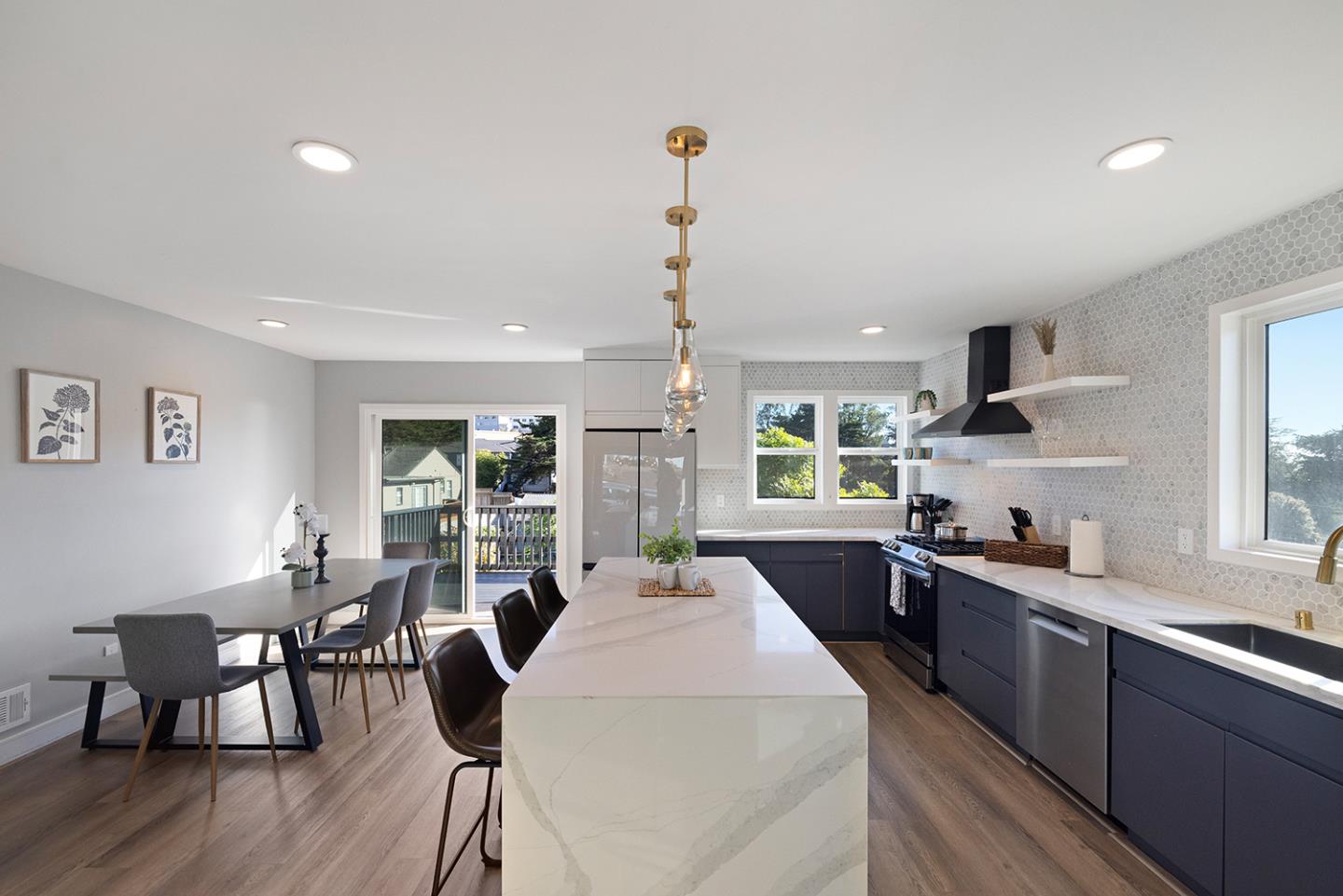 488 Monterey Road Pacifica, CA 94044 - Photo 24 of 78 a large kitchen with kitchen island a large island in the center
