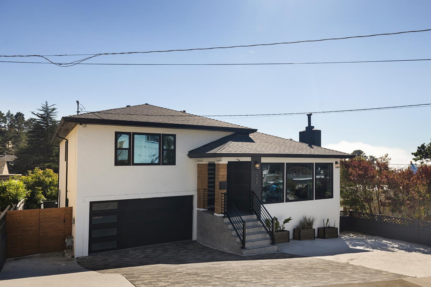 488 Monterey Road Pacifica, CA 94044 - Photo 3 of 78 a front view of a house with a yard