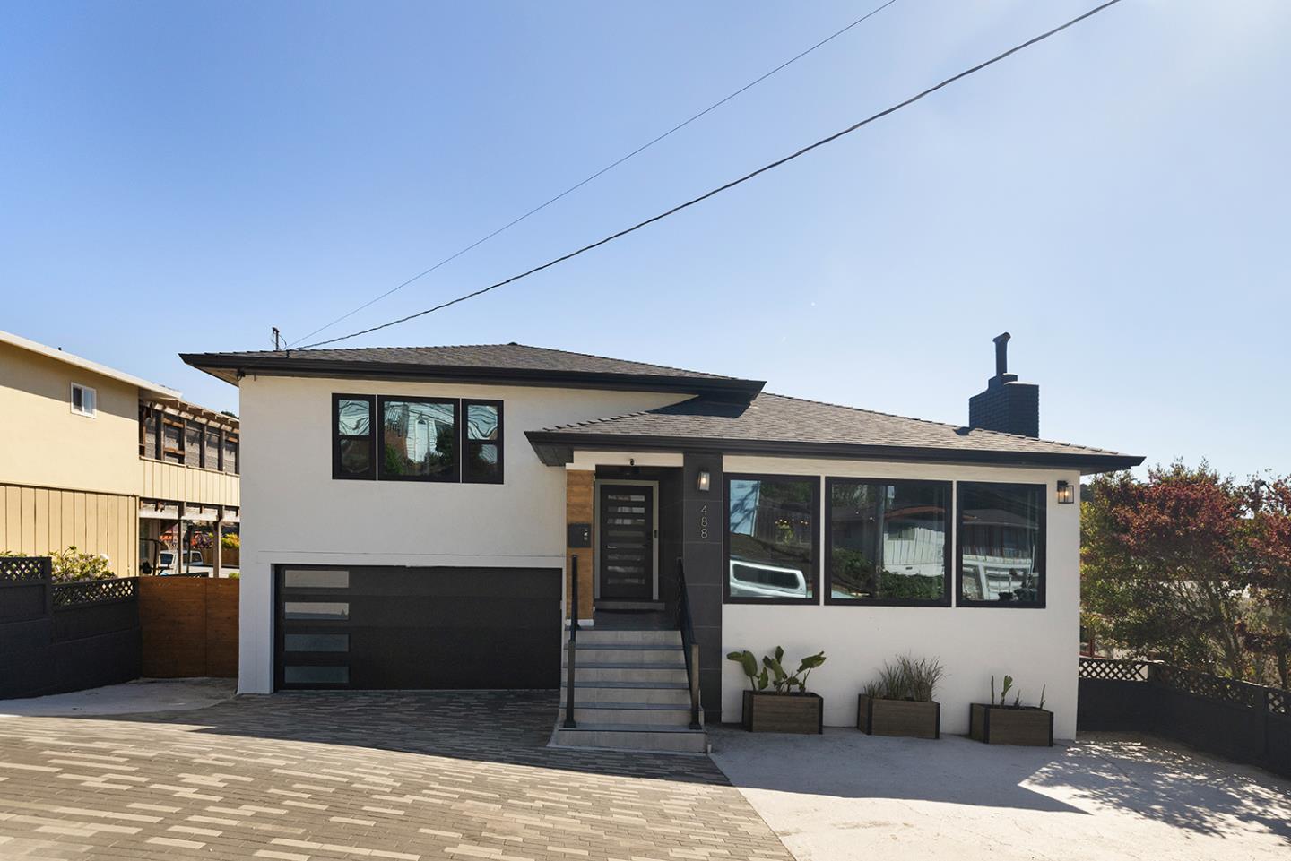 488 Monterey Road Pacifica, CA 94044 - Photo 4 of 78 a front view of a house with a garage