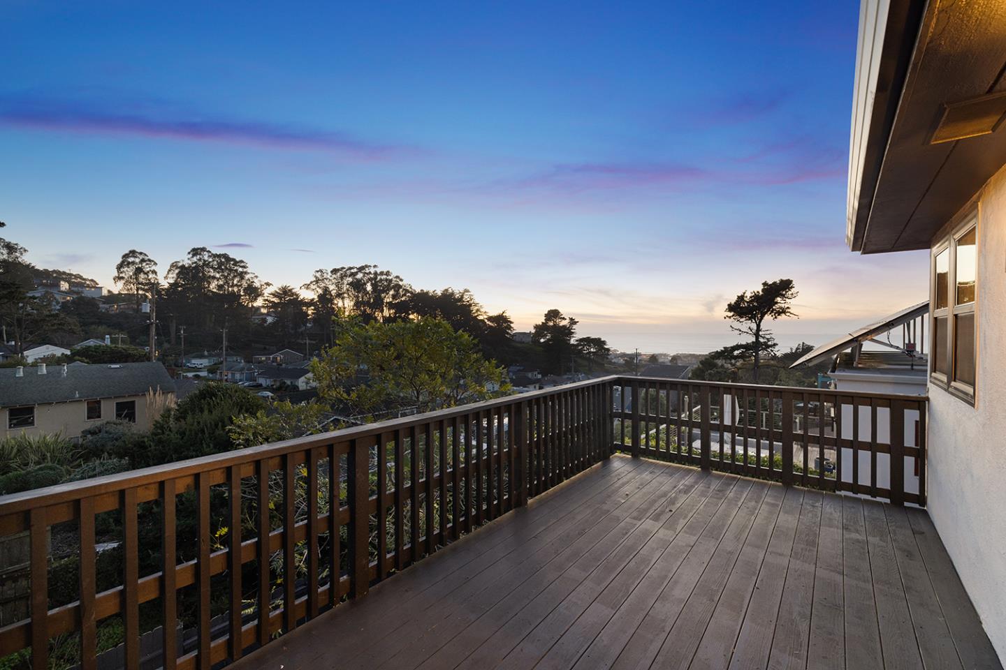 488 Monterey Road Pacifica, CA 94044 - Photo 5 of 78 a view of a balcony with wooden floor and fence