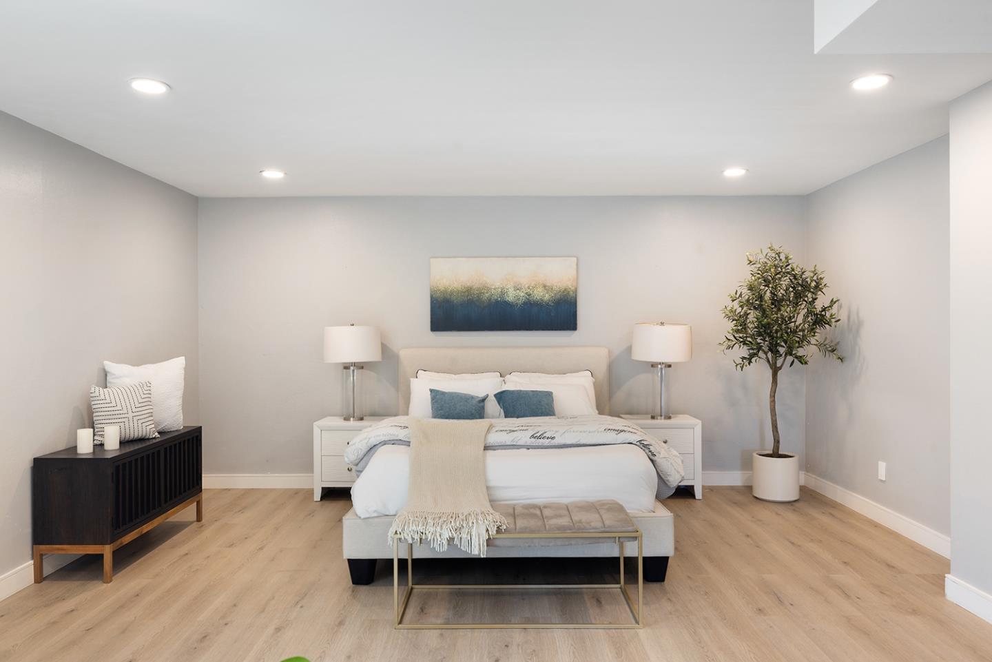 488 Monterey Road Pacifica, CA 94044 - Photo 58 of 78 a bedroom with a bed and a potted plant