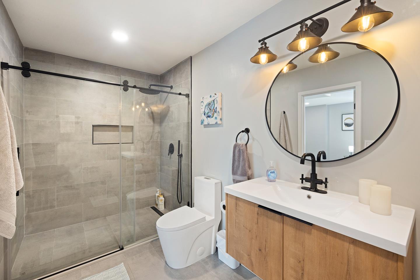 488 Monterey Road Pacifica, CA 94044 - Photo 59 of 78 a bathroom with a sink a toilet and a mirror