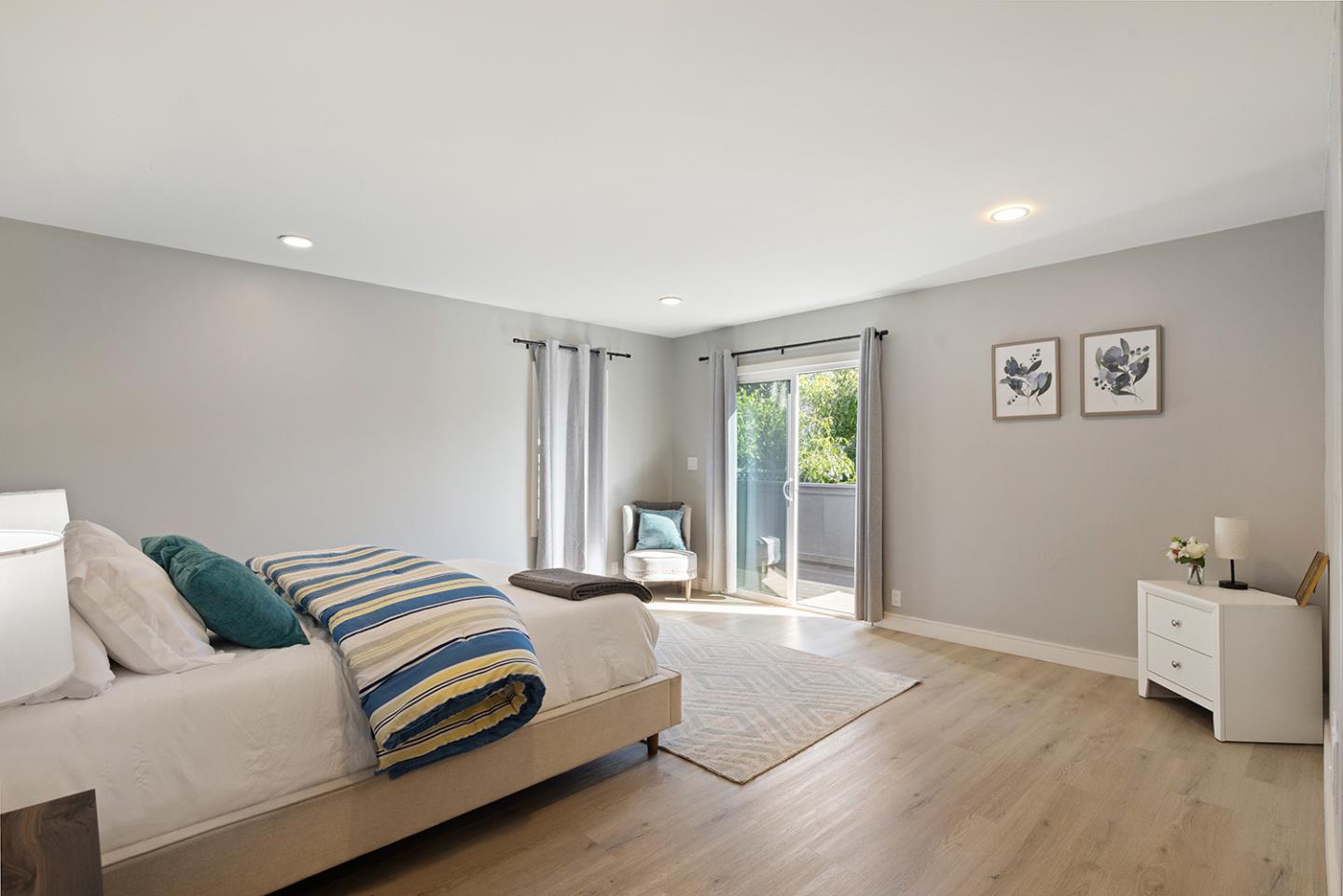 488 Monterey Road Pacifica, CA 94044 - Photo 60 of 78 a spacious bedroom with a bed and a couch